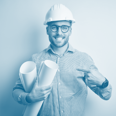 Smiling engineer wearing a white hard hat and glasses, holding two rolled-up blueprints, and pointing to himself. The image has a blue-green monochrome filter.