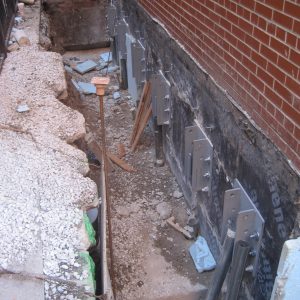 push piers along a foundation wall